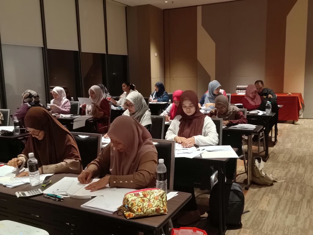 Lecturers working through the simulation